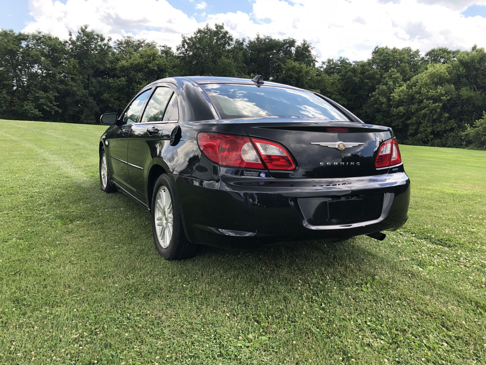 2007 Black Chrysler Sebring Touring (1C3LC56K97N) with an 2.4L L4 DOHC 16V engine, 4-Speed Automatic Overdrive transmission, located at 1800 South Ihm Blvd, Freeport, IL, 61032, (815) 232-5543, 42.278645, -89.607994 - Sebring Touring 4D Sedan - Photo #1