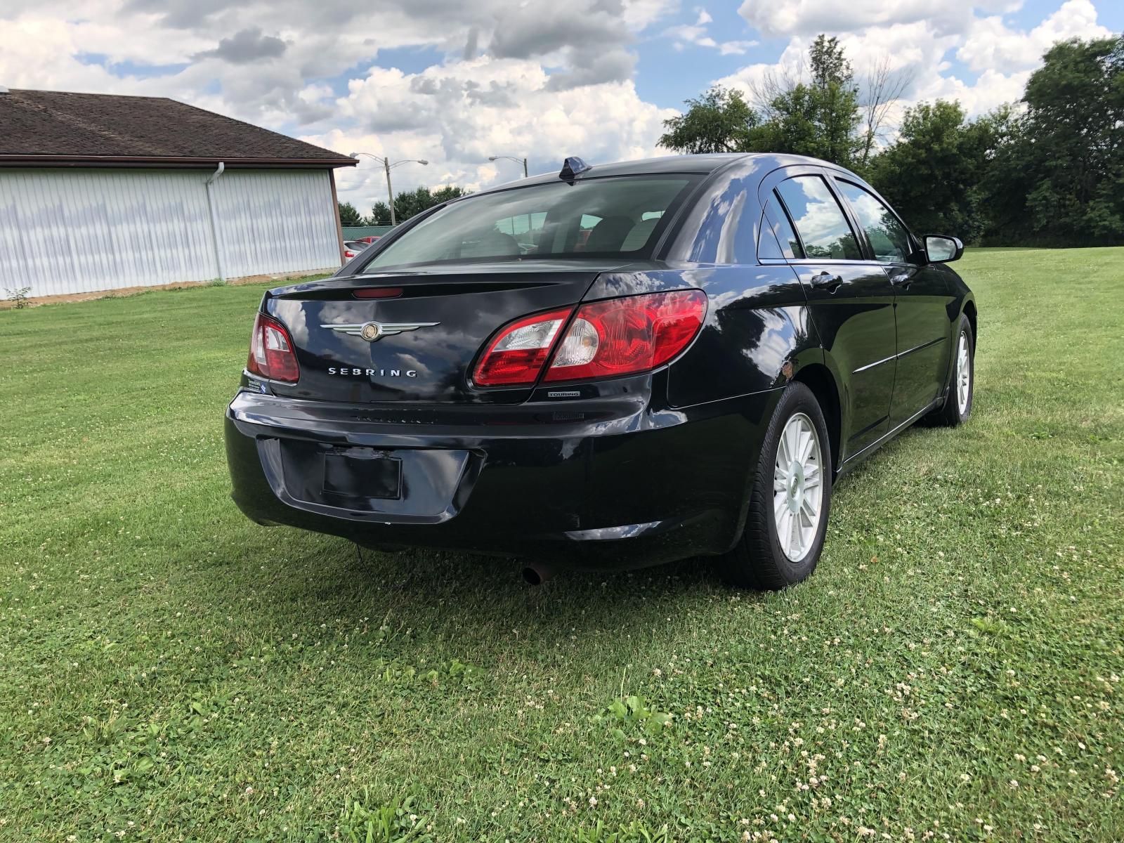 2007 Black Chrysler Sebring Touring (1C3LC56K97N) with an 2.4L L4 DOHC 16V engine, 4-Speed Automatic Overdrive transmission, located at 1800 South Ihm Blvd, Freeport, IL, 61032, (815) 232-5543, 42.278645, -89.607994 - Sebring Touring 4D Sedan - Photo #2