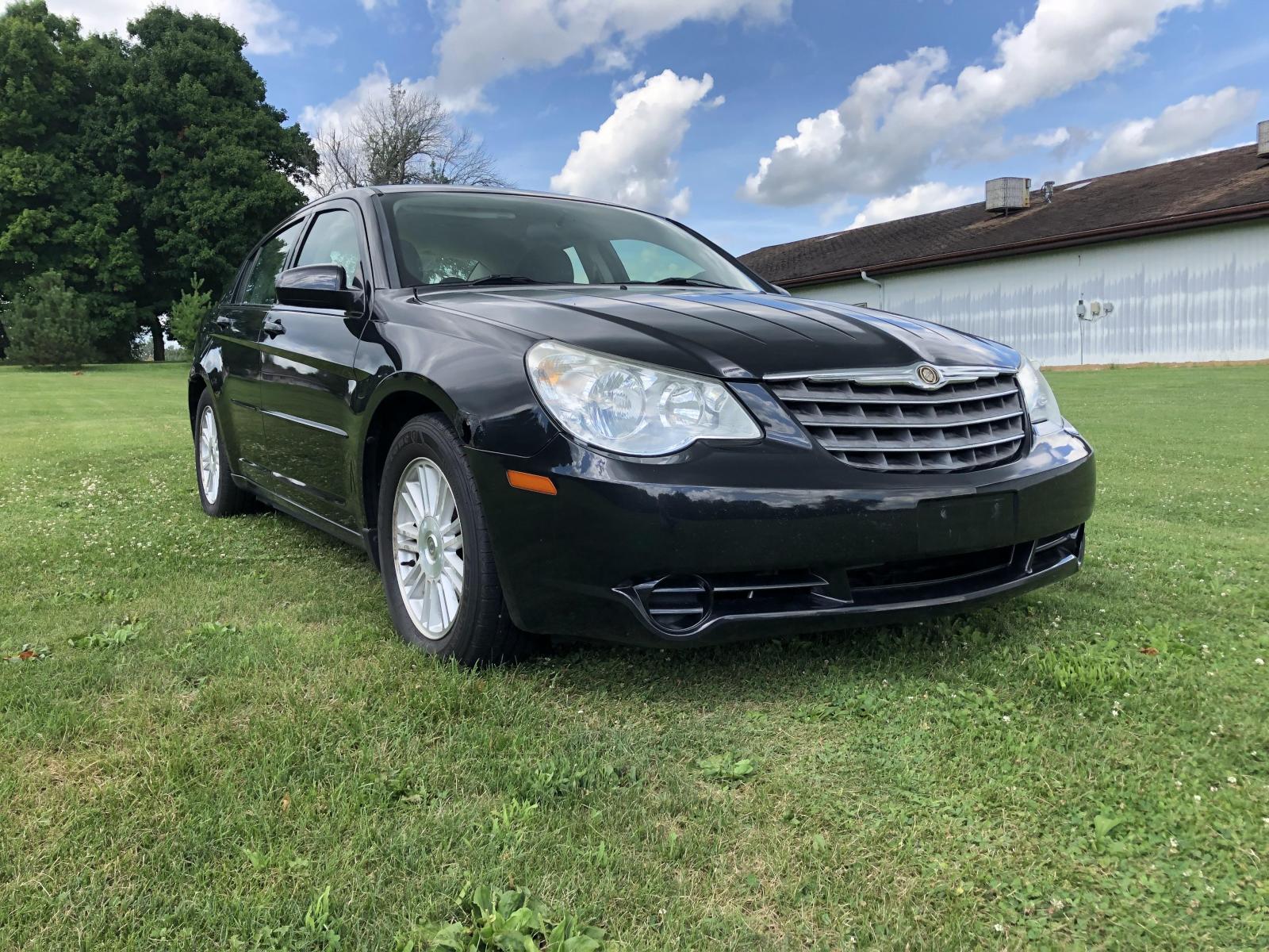 2007 Black Chrysler Sebring Touring (1C3LC56K97N) with an 2.4L L4 DOHC 16V engine, 4-Speed Automatic Overdrive transmission, located at 1800 South Ihm Blvd, Freeport, IL, 61032, (815) 232-5543, 42.278645, -89.607994 - Sebring Touring 4D Sedan - Photo #3