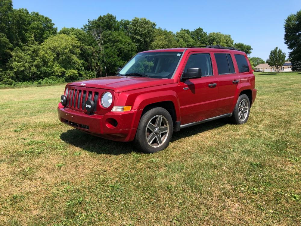 2009 Chili Pepper Me Jeep Patriot Sport 4WD (1J4FF28B49D) with an 2.4L L4 DOHC 16V engine, located at 1800 South Ihm Blvd, Freeport, IL, 61032, (815) 232-5543, 42.278645, -89.607994 - Photo #0