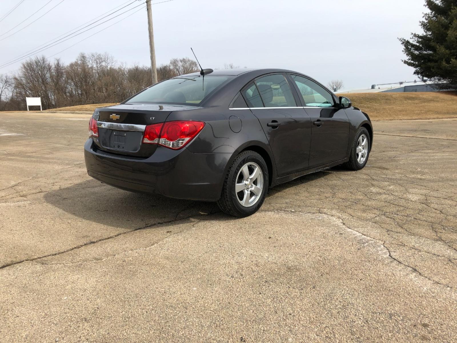 2015 Dark Graphite Met Chevrolet Cruze 1LT Auto (1G1PC5SBXF7) with an 1.4L L4 DOHC 16V TURBO engine, 6-Speed Automatic transmission, located at 1800 South Ihm Blvd, Freeport, IL, 61032, (815) 232-5543, 42.278645, -89.607994 - Photo #2