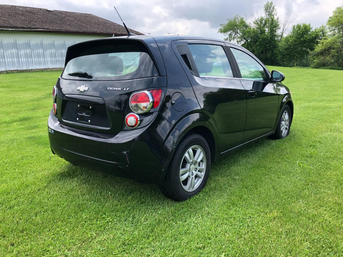 2012 Black Chevrolet Sonic 2LT 5-Door (1G1JC6SH2C4) with an 1.8L L4 DOHC 24V FFV engine, 6-Speed Automatic transmission, located at 1800 South Ihm Blvd, Freeport, IL, 61032, (815) 232-5543, 42.278645, -89.607994 - Sonic LT 4D Hatchback - Photo#2