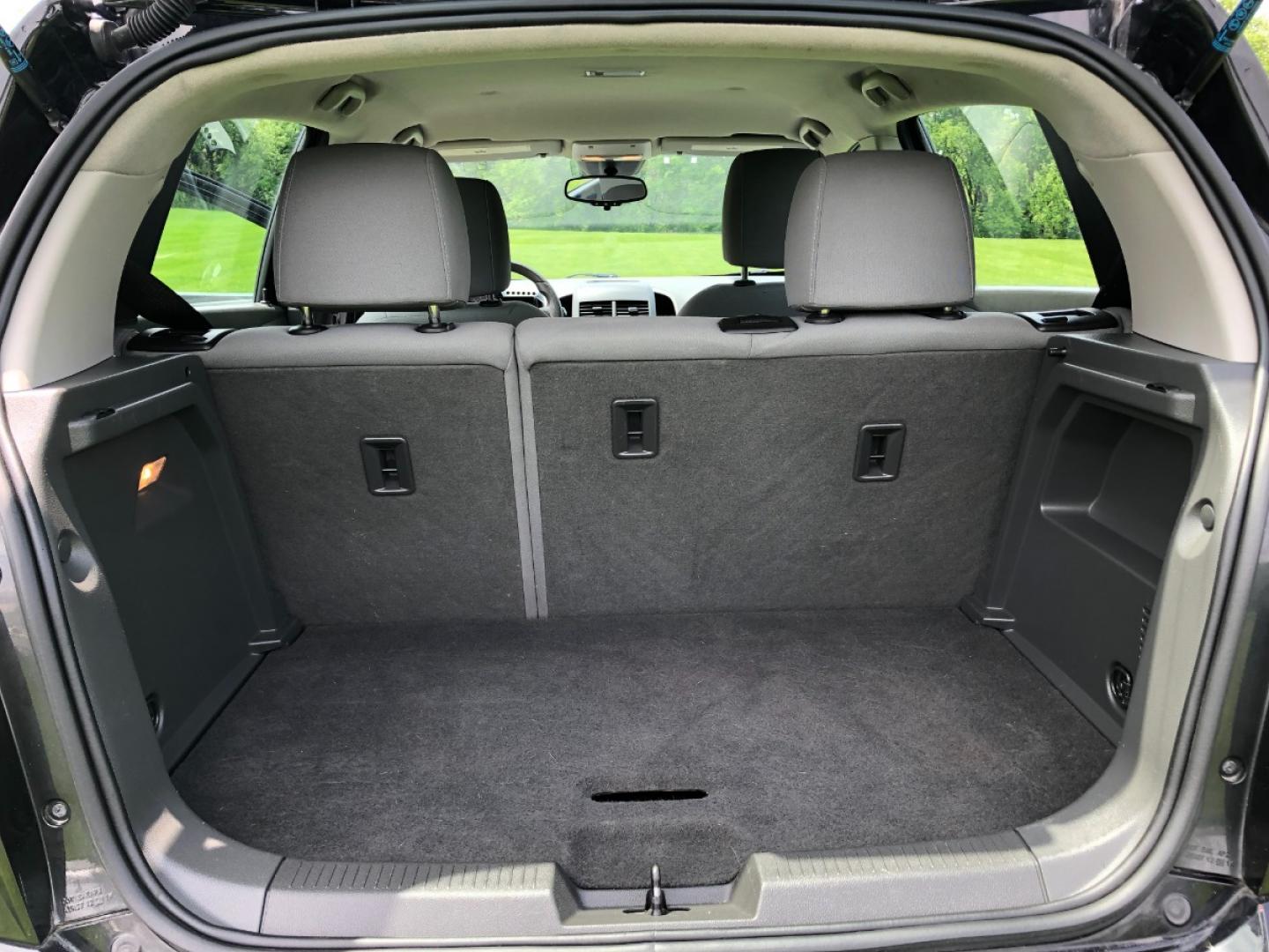 2012 Black Chevrolet Sonic 2LT 5-Door (1G1JC6SH2C4) with an 1.8L L4 DOHC 24V FFV engine, 6-Speed Automatic transmission, located at 1800 South Ihm Blvd, Freeport, IL, 61032, (815) 232-5543, 42.278645, -89.607994 - Sonic LT 4D Hatchback - Photo#7
