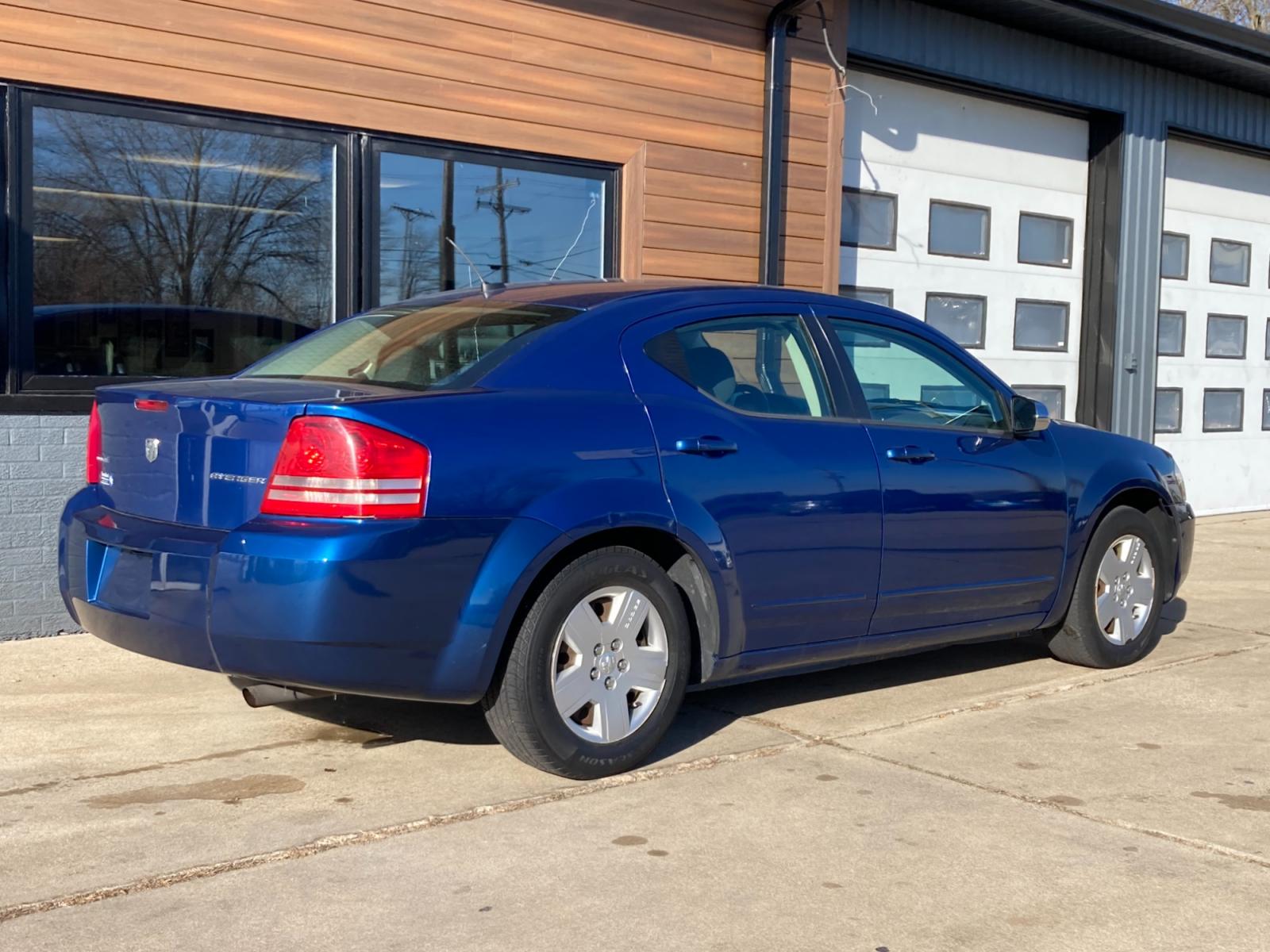 2009 Brilliant Blue Met Dodge Avenger SE (1B3LC46B19N) with an 2.0L L4 DOHC 16V engine, 4-Speed Automatic transmission, located at 1800 South Ihm Blvd, Freeport, IL, 61032, (815) 232-5543, 42.278645, -89.607994 - Photo #1