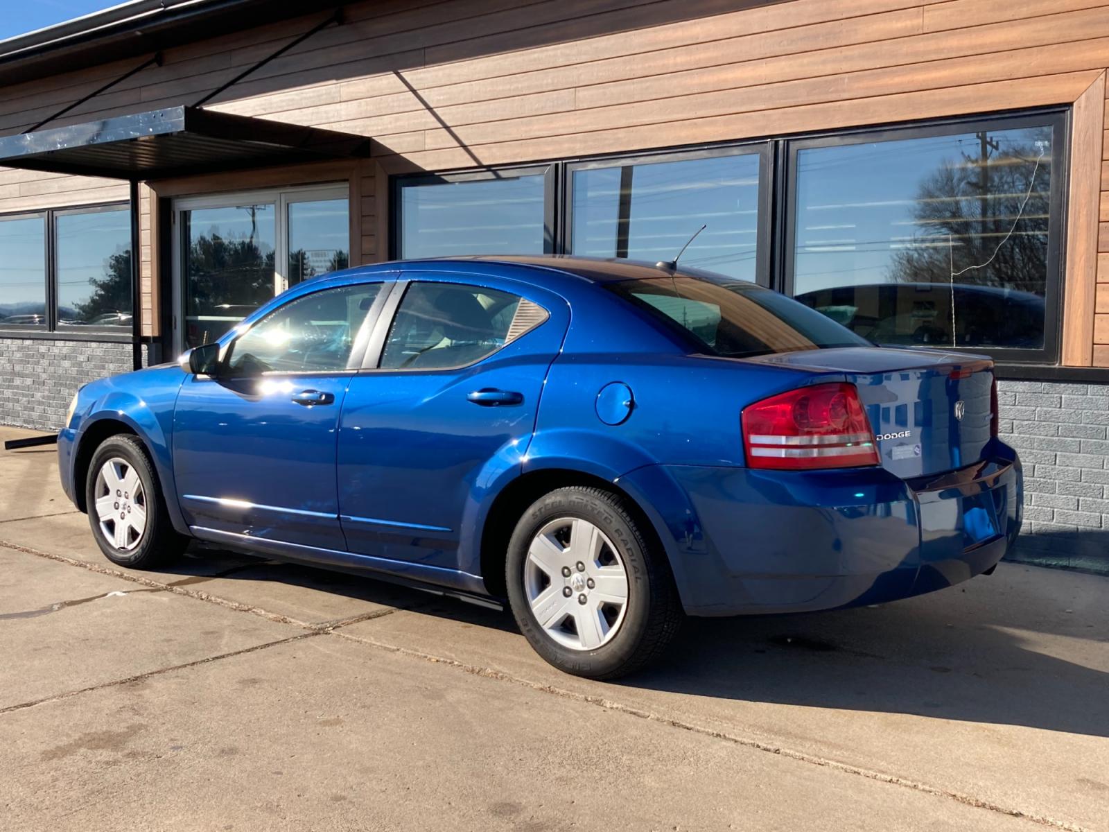2009 Brilliant Blue Met Dodge Avenger SE (1B3LC46B19N) with an 2.0L L4 DOHC 16V engine, 4-Speed Automatic transmission, located at 1800 South Ihm Blvd, Freeport, IL, 61032, (815) 232-5543, 42.278645, -89.607994 - Photo #2