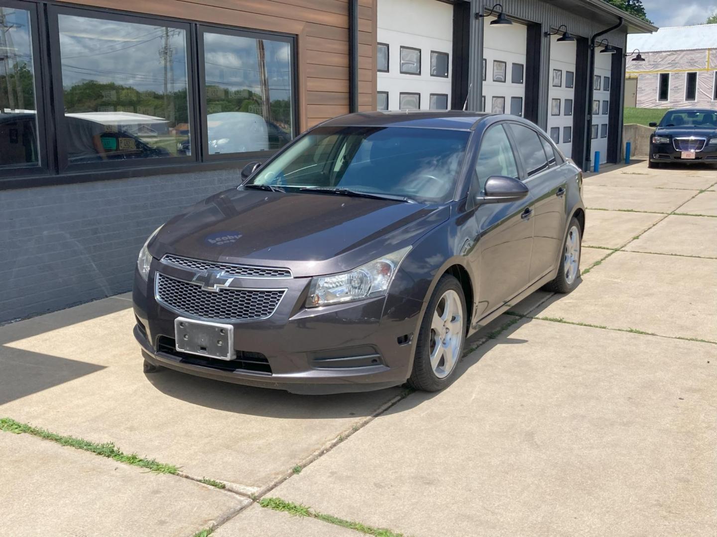 2014 Graphite Met. Chevrolet Cruze 1LT Auto (1G1PC5SB8E7) with an 1.4L L4 DOHC 16V TURBO engine, 6-Speed Automatic transmission, located at 1800 South Ihm Blvd, Freeport, IL, 61032, (815) 232-5543, 42.278645, -89.607994 - Cruze LT 4D Sedan - Photo#0