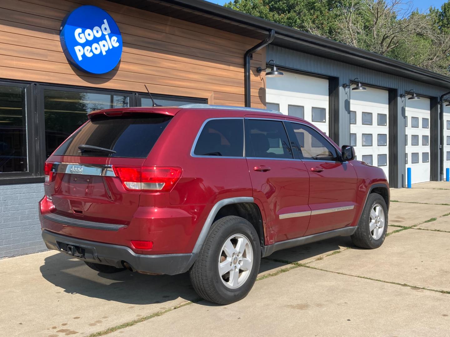 2012 Ruby Red Met Jeep Grand Cherokee Laredo 4WD (1C4RJFAG4CC) with an 3.6L V6 DOHC 24V engine, 5-Speed Automatic transmission, located at 1800 South Ihm Blvd, Freeport, IL, 61032, (815) 232-5543, 42.278645, -89.607994 - Photo#1