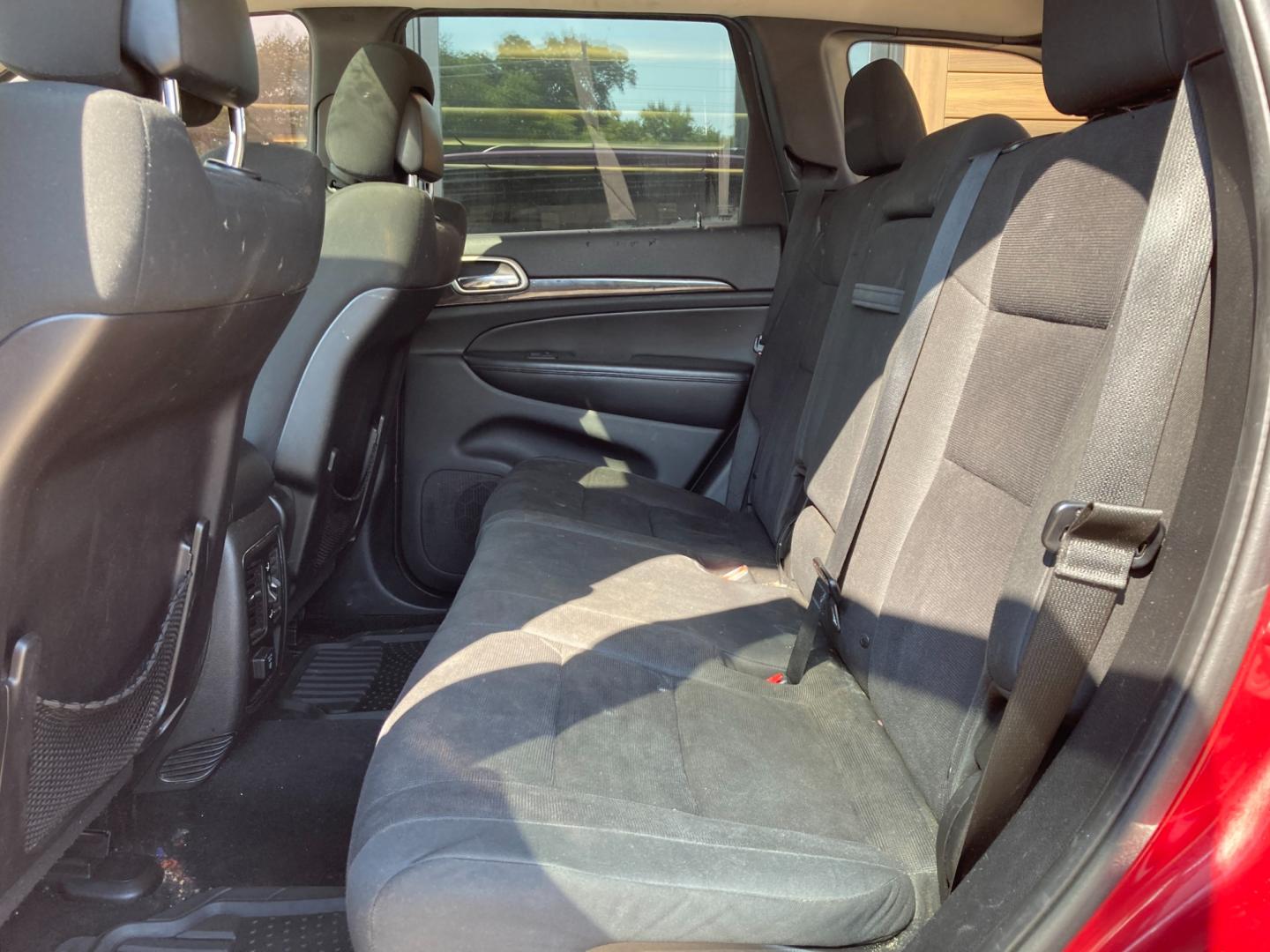 2012 Ruby Red Met Jeep Grand Cherokee Laredo 4WD (1C4RJFAG4CC) with an 3.6L V6 DOHC 24V engine, 5-Speed Automatic transmission, located at 1800 South Ihm Blvd, Freeport, IL, 61032, (815) 232-5543, 42.278645, -89.607994 - Photo#8