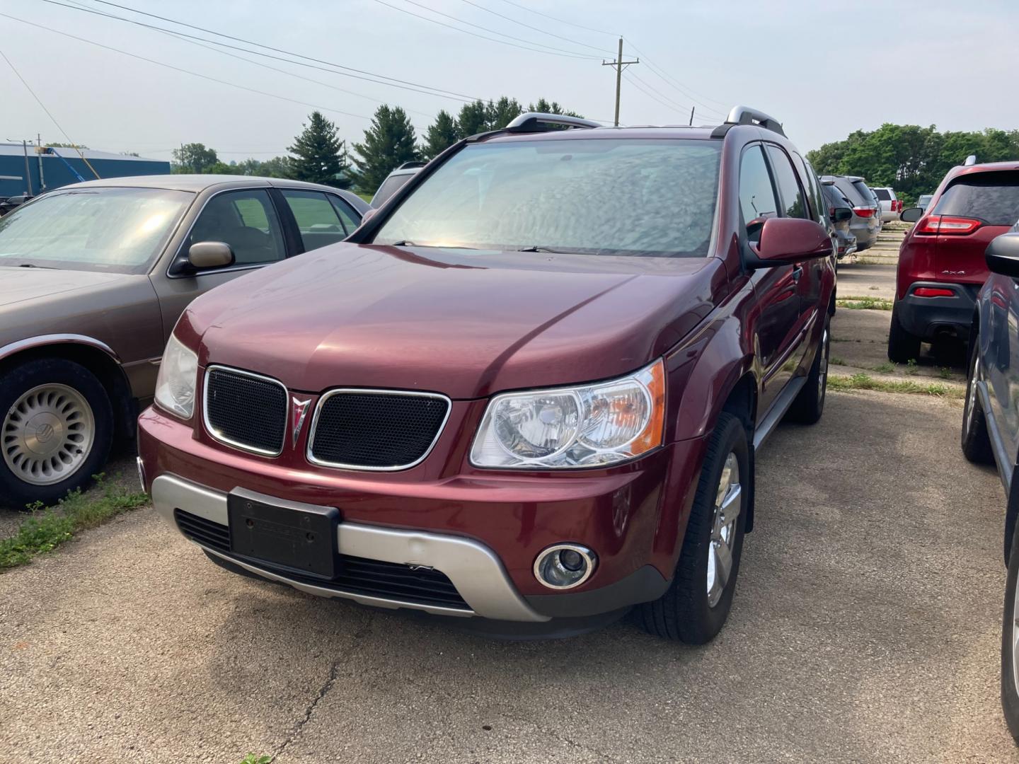 2008 Ruby Red Met Pontiac Torrent AWD (2CKDL43F386) with an 3.4L V6 OHV 12V engine, 5-Speed Automatic transmission, located at 1800 South Ihm Blvd, Freeport, IL, 61032, (815) 232-5543, 42.278645, -89.607994 - Photo#0