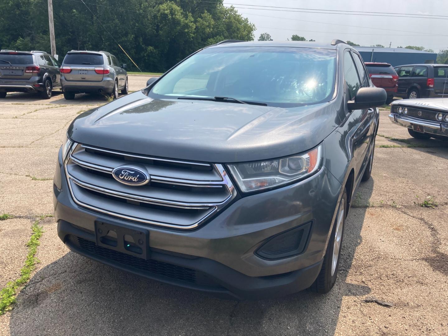 2016 Magnetic Gray Met Ford Edge SE FWD (2FMPK3G98GB) with an 2.0L L4 DOHC 16V engine, 6A transmission, located at 1800 South Ihm Blvd, Freeport, IL, 61032, (815) 232-5543, 42.278645, -89.607994 - Edge SE 4D SUV FWD - Photo#0