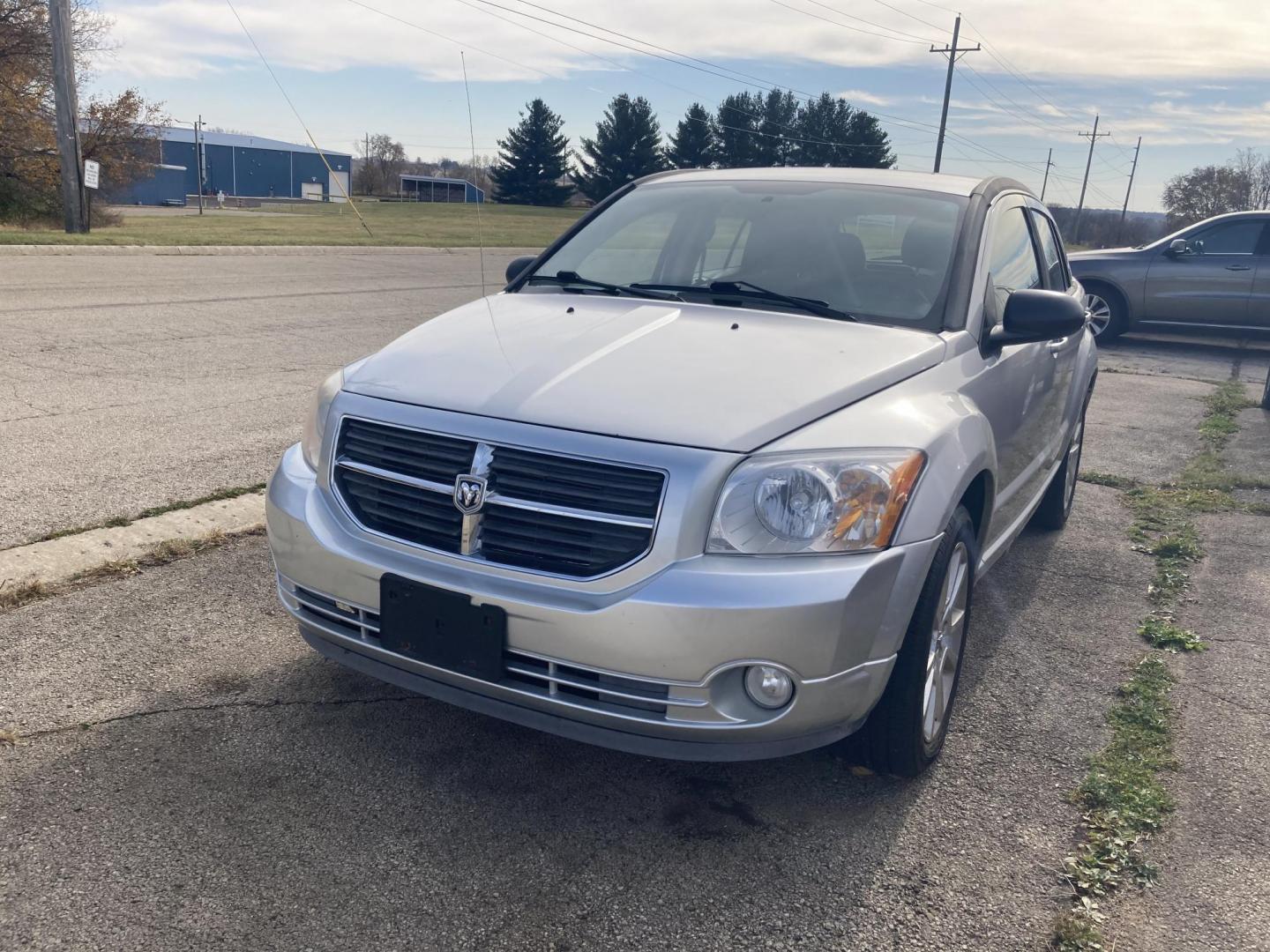 2011 Billit Silver Dodge Caliber Heat (1B3CB5HA9BD) with an 2.0L L4 DOHC 16V engine, 5-Speed Manual transmission, located at 1800 South Ihm Blvd, Freeport, IL, 61032, (815) 232-5543, 42.278645, -89.607994 - Caliber Heat 4D Hatchback - Photo#0