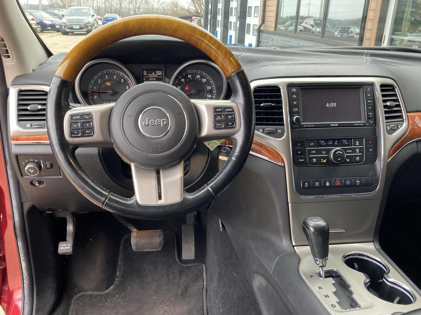 2012 Garnet Red Met. Jeep Grand Cherokee Overland 4WD (1C4RJFCT6CC) with an 5.7L V8 OHV 16V engine, 5-Speed Automatic transmission, located at 1800 South Ihm Blvd, Freeport, IL, 61032, (815) 232-5543, 42.278645, -89.607994 - Photo#5
