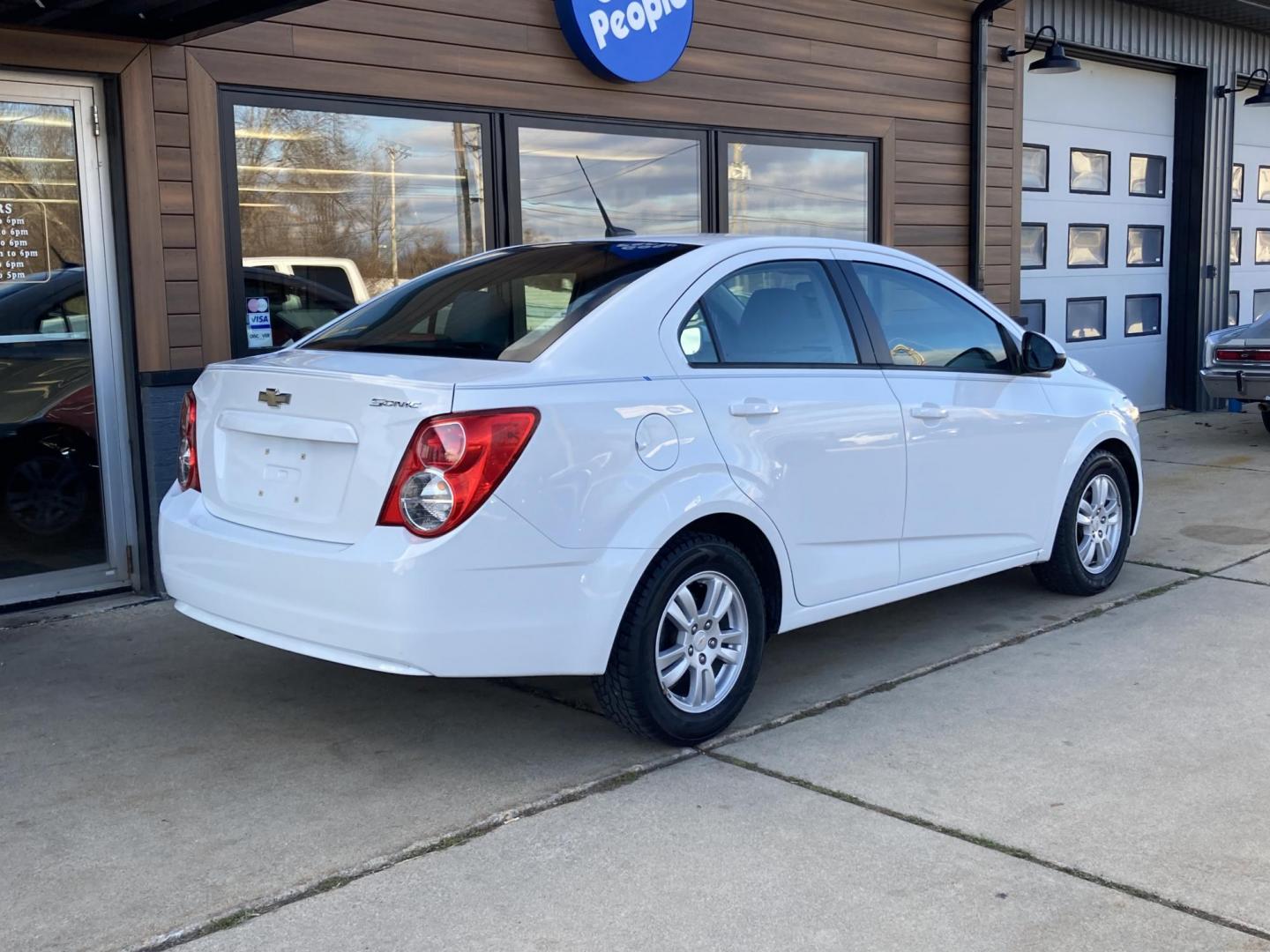 2012 Arctic White Chevrolet Sonic 2LS Sedan (1G1JA5SHXC4) with an 1.8L L4 DOHC 24V FFV engine, 6-Speed Automatic transmission, located at 1800 South Ihm Blvd, Freeport, IL, 61032, (815) 232-5543, 42.278645, -89.607994 - Photo#1