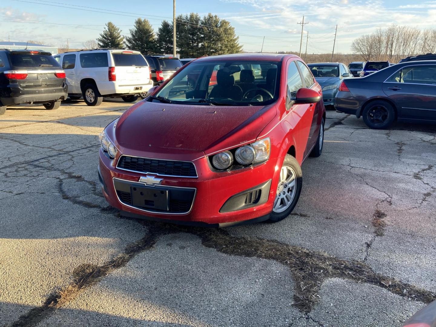 2015 Firethorn Red Met. Chevrolet Sonic LT Auto Sedan (1G1JC5SB8F4) with an 1.4L L4 DOHC 24V TURBO engine, 6-Speed Automatic transmission, located at 1800 South Ihm Blvd, Freeport, IL, 61032, (815) 232-5543, 42.278645, -89.607994 - Photo#0