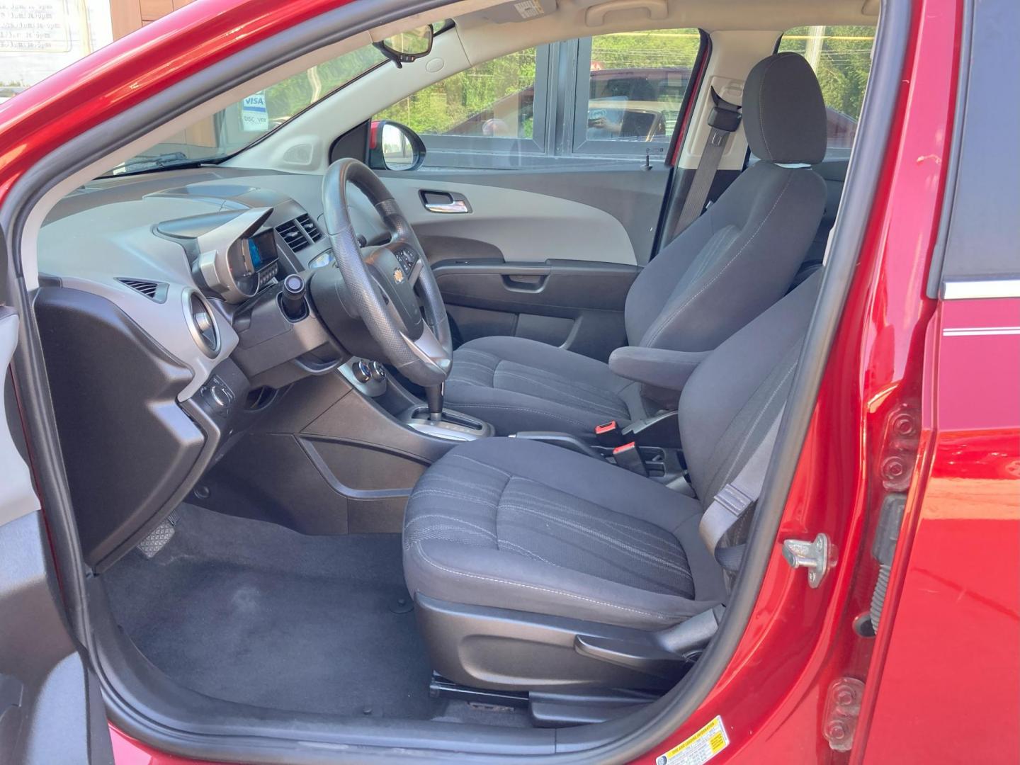 2015 Firethorn Red Met. Chevrolet Sonic LT Auto Sedan (1G1JC5SB8F4) with an 1.4L L4 DOHC 24V TURBO engine, 6-Speed Automatic transmission, located at 1800 South Ihm Blvd, Freeport, IL, 61032, (815) 232-5543, 42.278645, -89.607994 - Sonic LT 4D Sedan - Photo#1