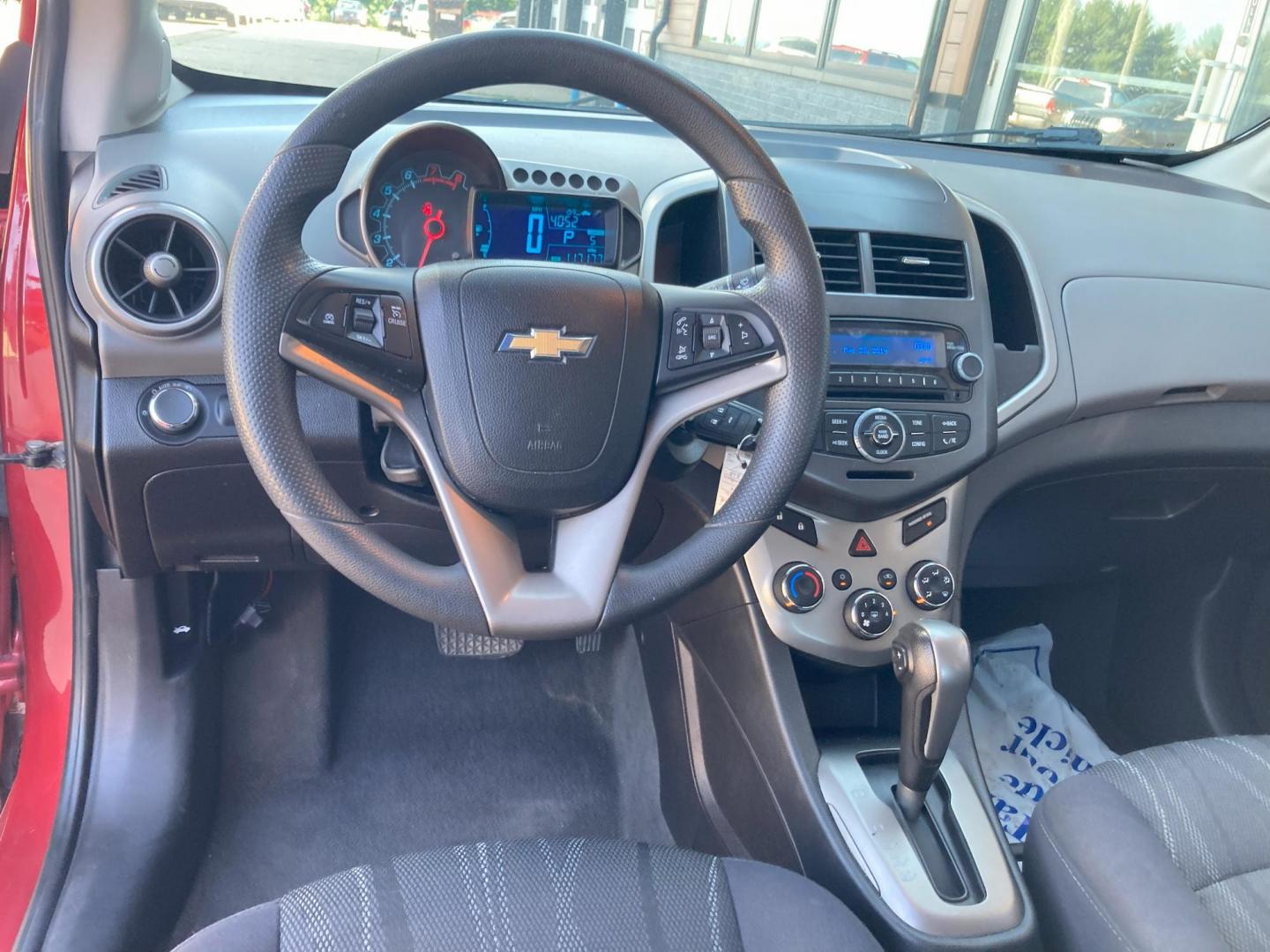 2015 Firethorn Red Met. Chevrolet Sonic LT Auto Sedan (1G1JC5SB8F4) with an 1.4L L4 DOHC 24V TURBO engine, 6-Speed Automatic transmission, located at 1800 South Ihm Blvd, Freeport, IL, 61032, (815) 232-5543, 42.278645, -89.607994 - Sonic LT 4D Sedan - Photo#2