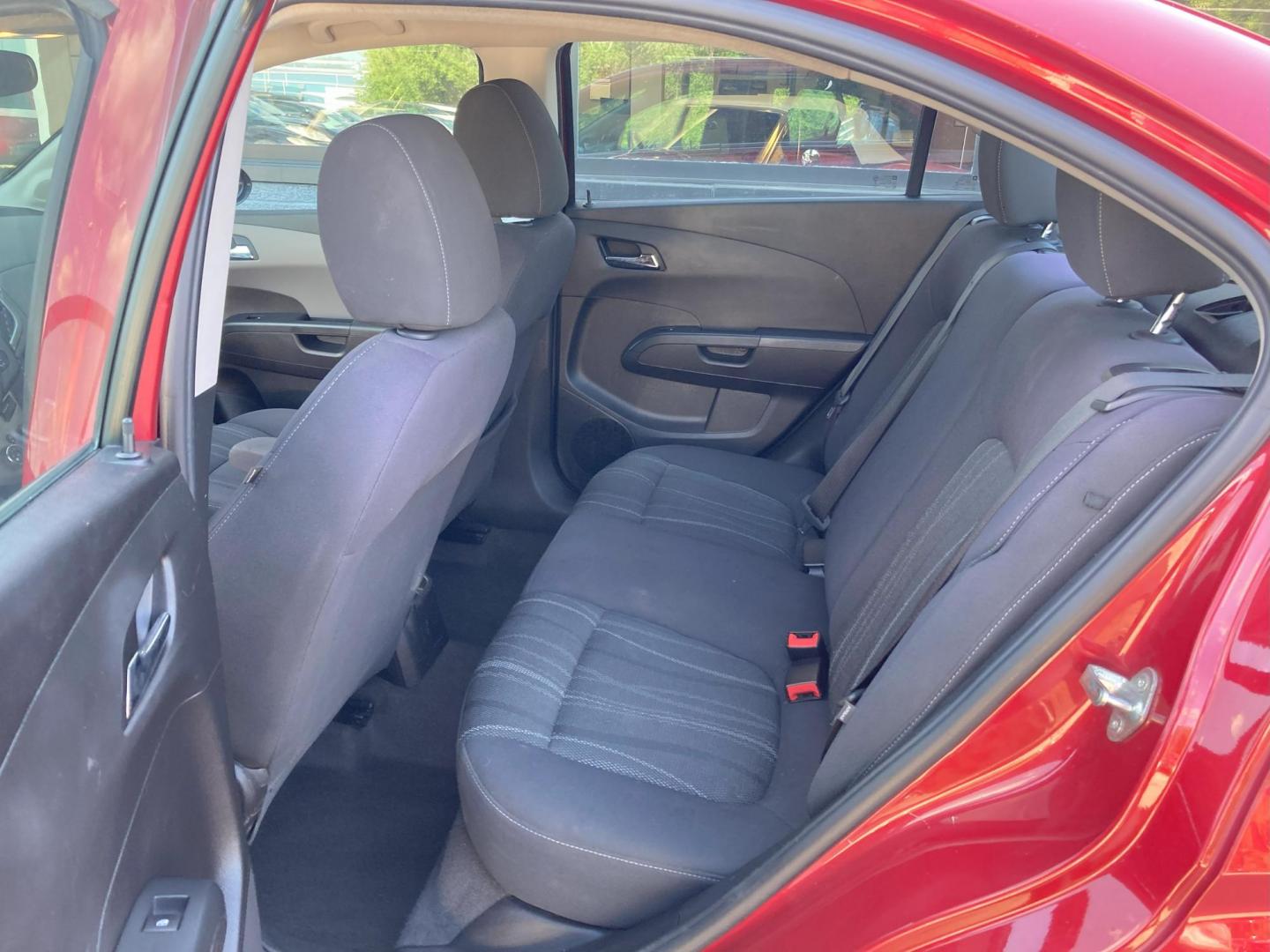 2015 Firethorn Red Met. Chevrolet Sonic LT Auto Sedan (1G1JC5SB8F4) with an 1.4L L4 DOHC 24V TURBO engine, 6-Speed Automatic transmission, located at 1800 South Ihm Blvd, Freeport, IL, 61032, (815) 232-5543, 42.278645, -89.607994 - Sonic LT 4D Sedan - Photo#7