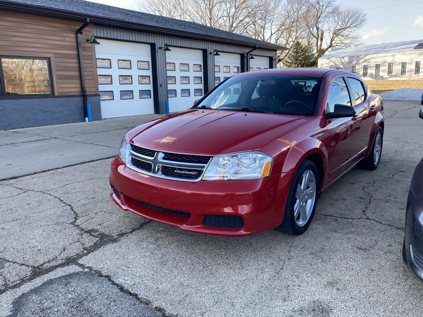 2013 Inferno Red Met Dodge Avenger Base (1C3CDZAB8DN) with an 2.4L L4 DOHC 16V engine, 4-Speed Automatic transmission, located at 1800 South Ihm Blvd, Freeport, IL, 61032, (815) 232-5543, 42.278645, -89.607994 - Photo#0