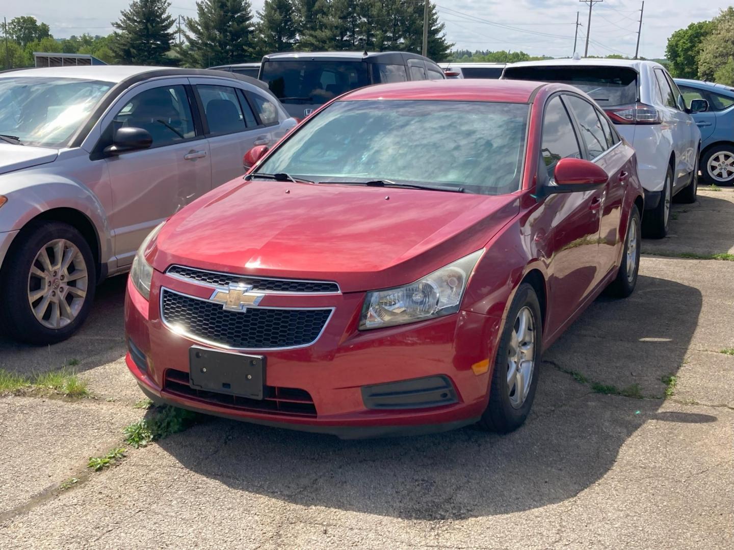 2012 Garnet Red Met Chevrolet Cruze 1LT (1G1PF5SC2C7) with an 1.4L L4 DOHC 16V TURBO engine, 6-Speed Automatic transmission, located at 1800 South Ihm Blvd, Freeport, IL, 61032, (815) 232-5543, 42.278645, -89.607994 - Cruze LT 4D Sedan - Photo#0