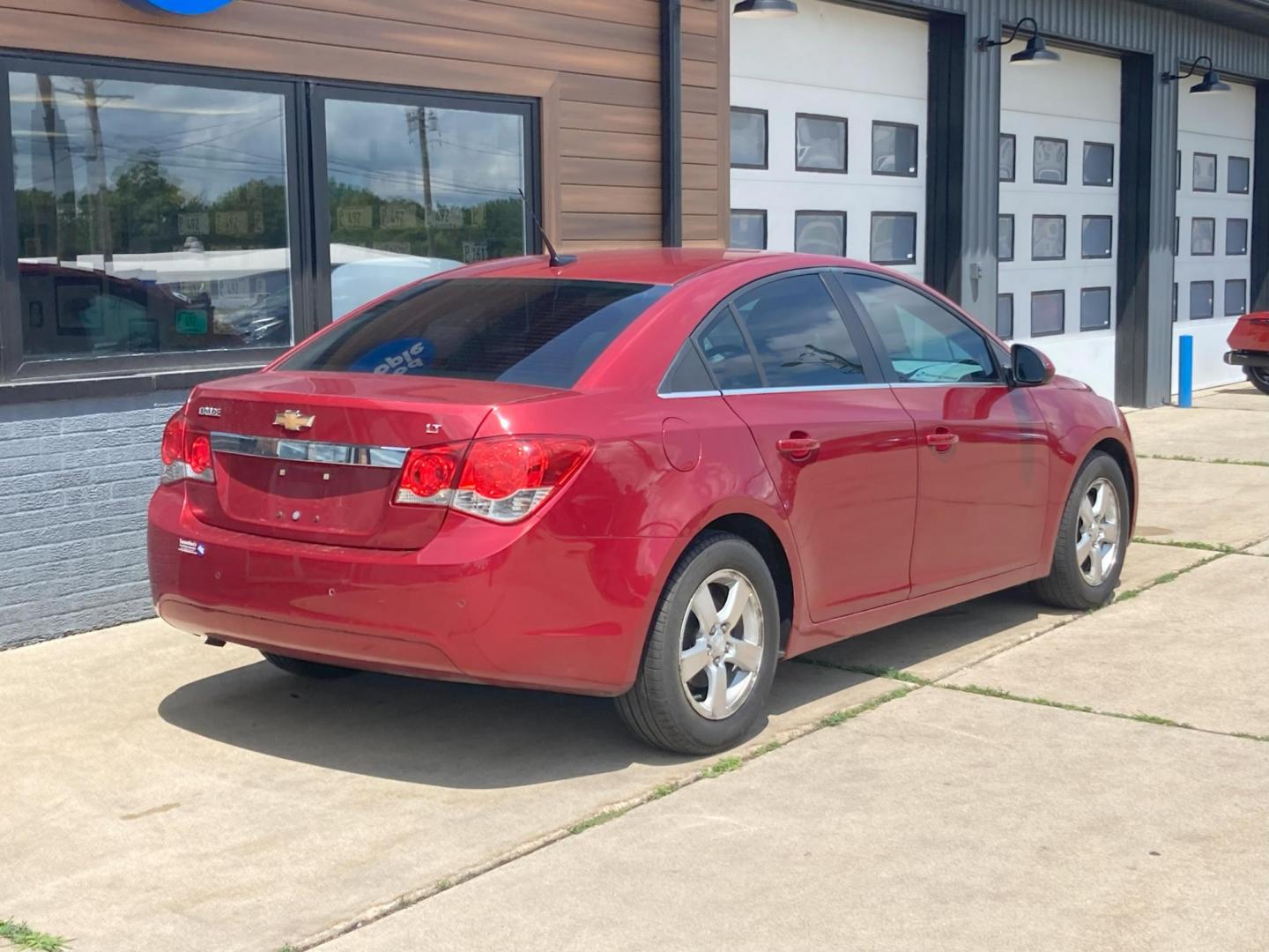 2012 Garnet Red Met Chevrolet Cruze 1LT (1G1PF5SC2C7) with an 1.4L L4 DOHC 16V TURBO engine, 6-Speed Automatic transmission, located at 1800 South Ihm Blvd, Freeport, IL, 61032, (815) 232-5543, 42.278645, -89.607994 - Photo#2