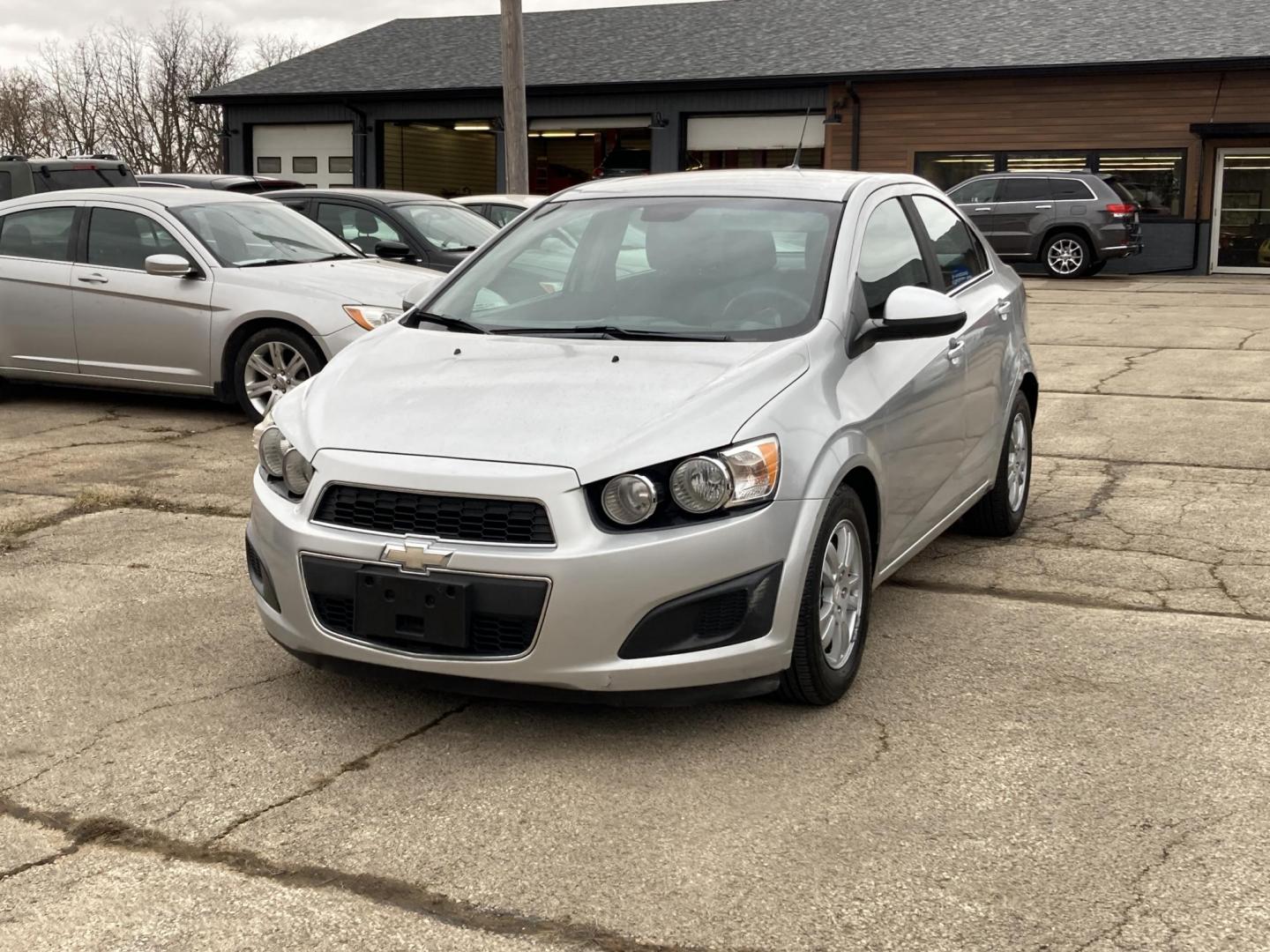 2012 Bright Silver Chevrolet Sonic 2LT Sedan (1G1JC5SH6C4) with an 1.8L L4 DOHC 24V FFV engine, 6-Speed Automatic transmission, located at 1800 South Ihm Blvd, Freeport, IL, 61032, (815) 232-5543, 42.278645, -89.607994 - Sonic LT 4D Sedan - Photo#0