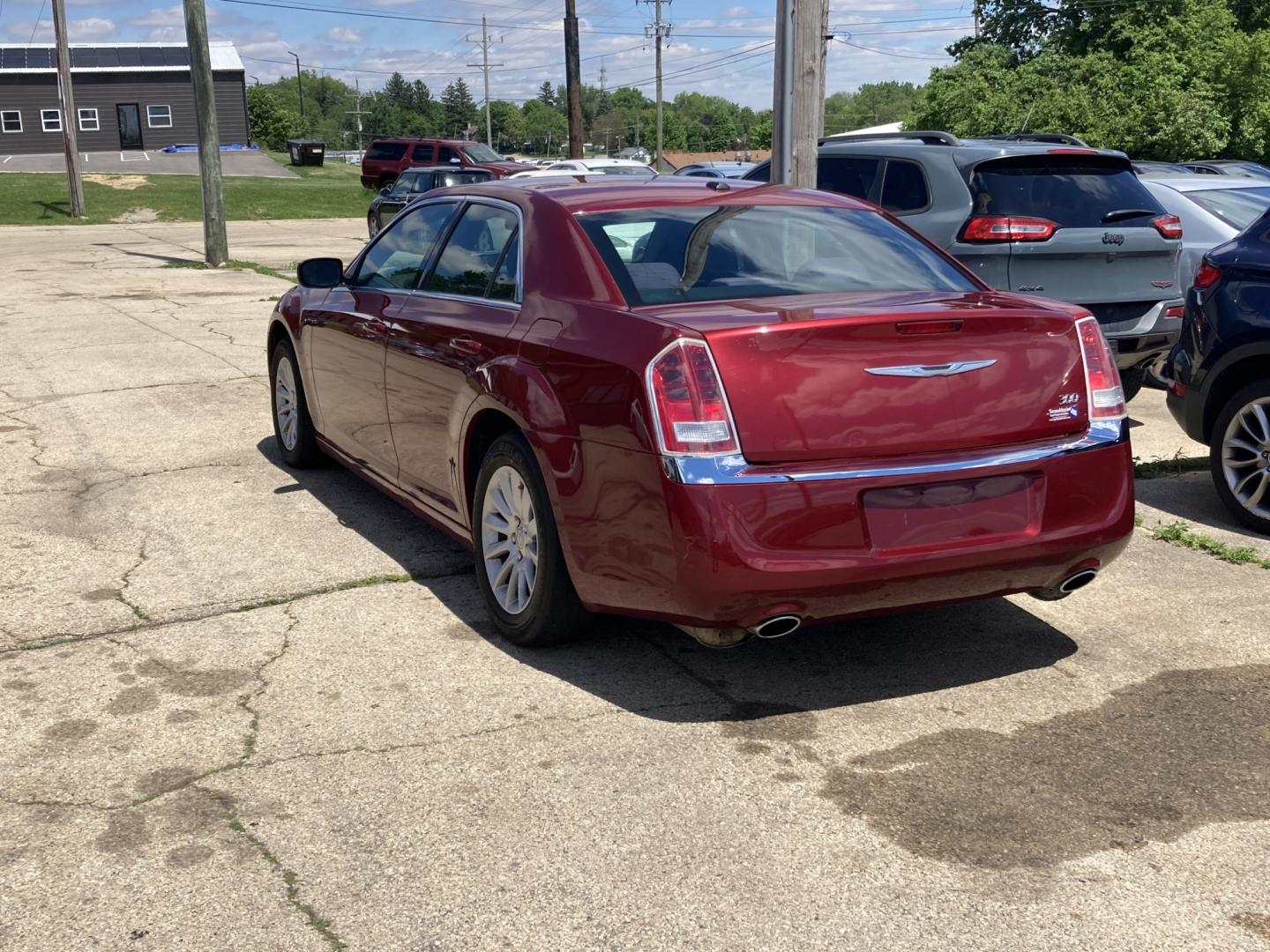 2012 Medium Red Met Chrysler 300 Base (2C3CCAAG6CH) with an 3.6L V6 SOHC 24V engine, 5-Speed Automatic transmission, located at 1800 South Ihm Blvd, Freeport, IL, 61032, (815) 232-5543, 42.278645, -89.607994 - 300 Base 4D Sedan- Photo#2