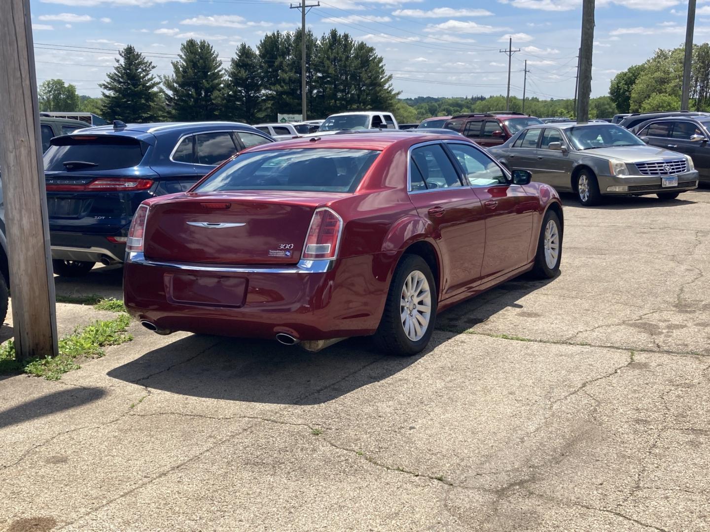 2012 Medium Red Met Chrysler 300 Base (2C3CCAAG6CH) with an 3.6L V6 SOHC 24V engine, 5-Speed Automatic transmission, located at 1800 South Ihm Blvd, Freeport, IL, 61032, (815) 232-5543, 42.278645, -89.607994 - 300 Base 4D Sedan- Photo#1