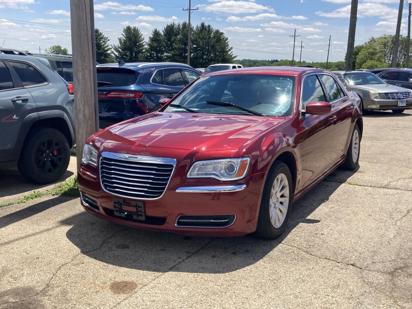2012 Medium Red Met Chrysler 300 Base (2C3CCAAG6CH) with an 3.6L V6 SOHC 24V engine, 5-Speed Automatic transmission, located at 1800 South Ihm Blvd, Freeport, IL, 61032, (815) 232-5543, 42.278645, -89.607994 - 300 Base 4D Sedan- Photo#3